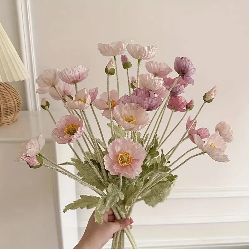 premium realistic artificial poppy flowers bouquet with gradient pink silk petals held by a hand
