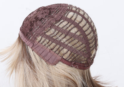 detailed close up of the breathable open weft inner wig cap structure with adjustable straps on synthetic bob wig