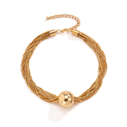 elegant minimalist multi strand layered chain necklace with metal beads on a clean background