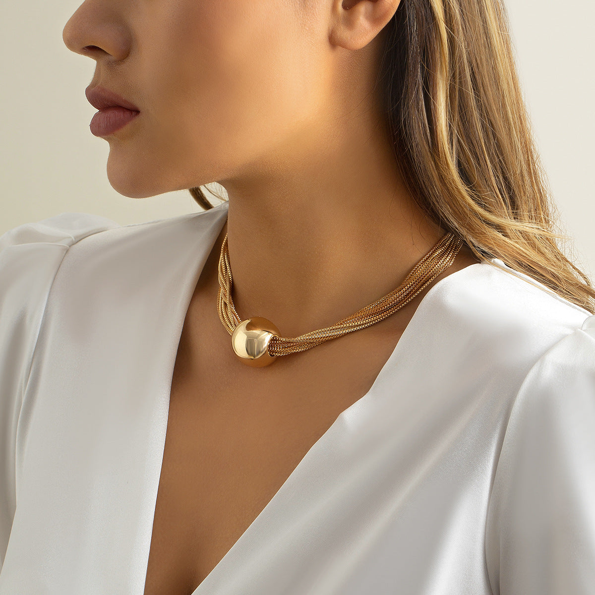 gorgeous model wearing the luxury bohemian multi row metallic chain choker necklace with beads