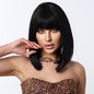front view of the trendy straight shoulder length black synthetic wig with bangs worn by a model