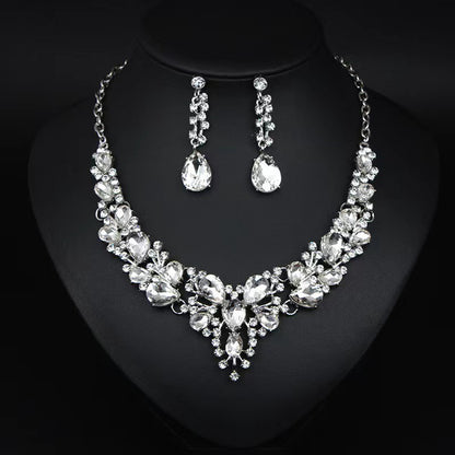 elegant waterdrop crystal bridal jewelry set in classic silver color displayed on a black neck mannequin bust