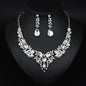 elegant waterdrop crystal bridal jewelry set in classic silver color displayed on a black neck mannequin bust