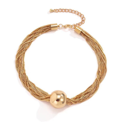 elegant minimalist multi strand layered chain necklace with metal beads on a clean background