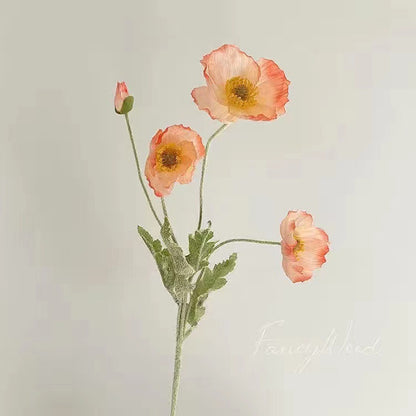 realistic faux silk poppy flowers in vibrant sunset orange color on a clean white background