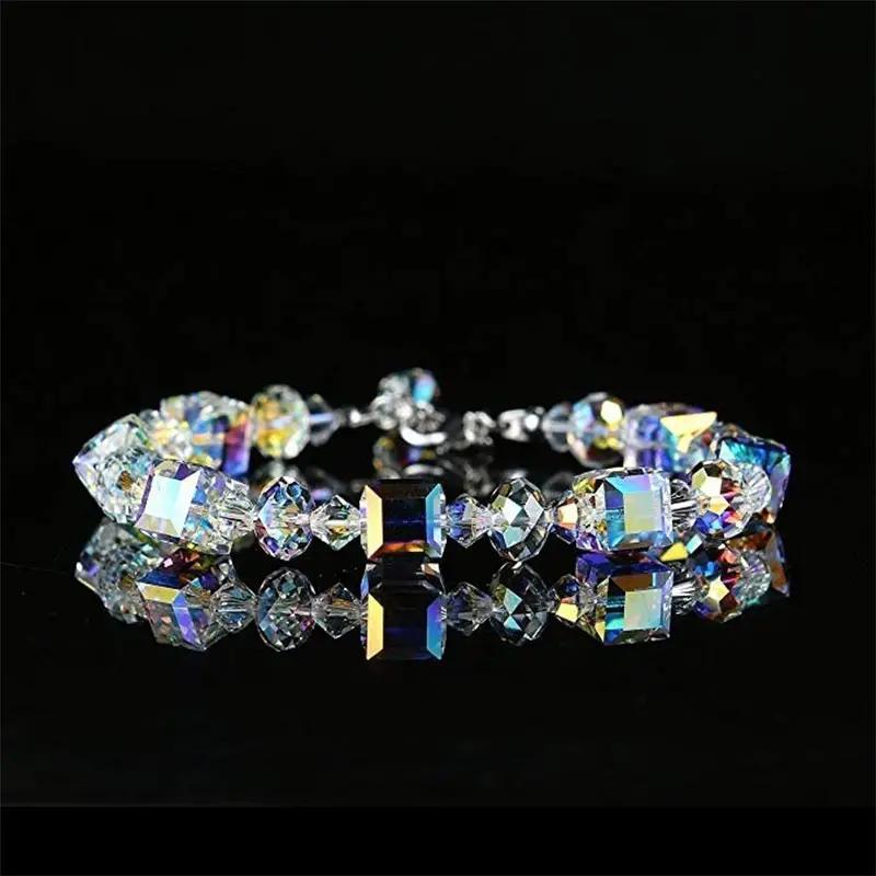 bohemian multicolor cube crystal bead bracelet arranged in a circle on a reflective black background