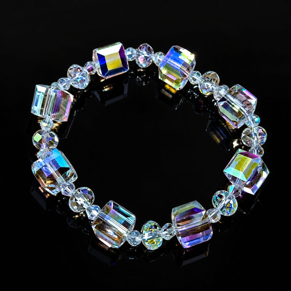 bohemian multicolor cube crystal bead bracelet arranged in a circle on a reflective black background
