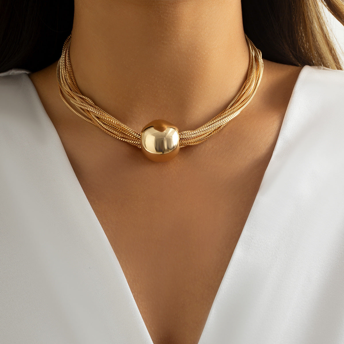monica multi strand chunky choker with gold multi chain design and high shine metallic bead