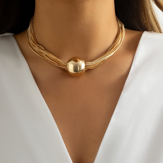 monica multi strand chunky choker with gold multi chain design and high shine metallic bead
