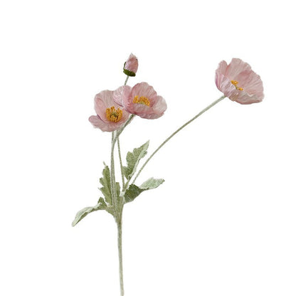 realistic faux silk poppy flowers in light pink color on a clean white background