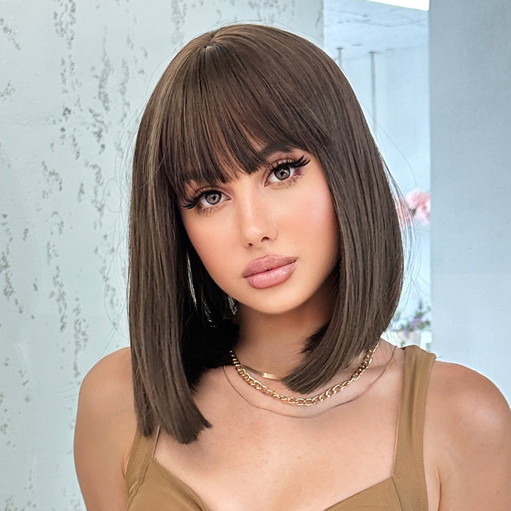 front view of trendy straight dark brown synthetic bob wig worn by a model in outdoor lighting