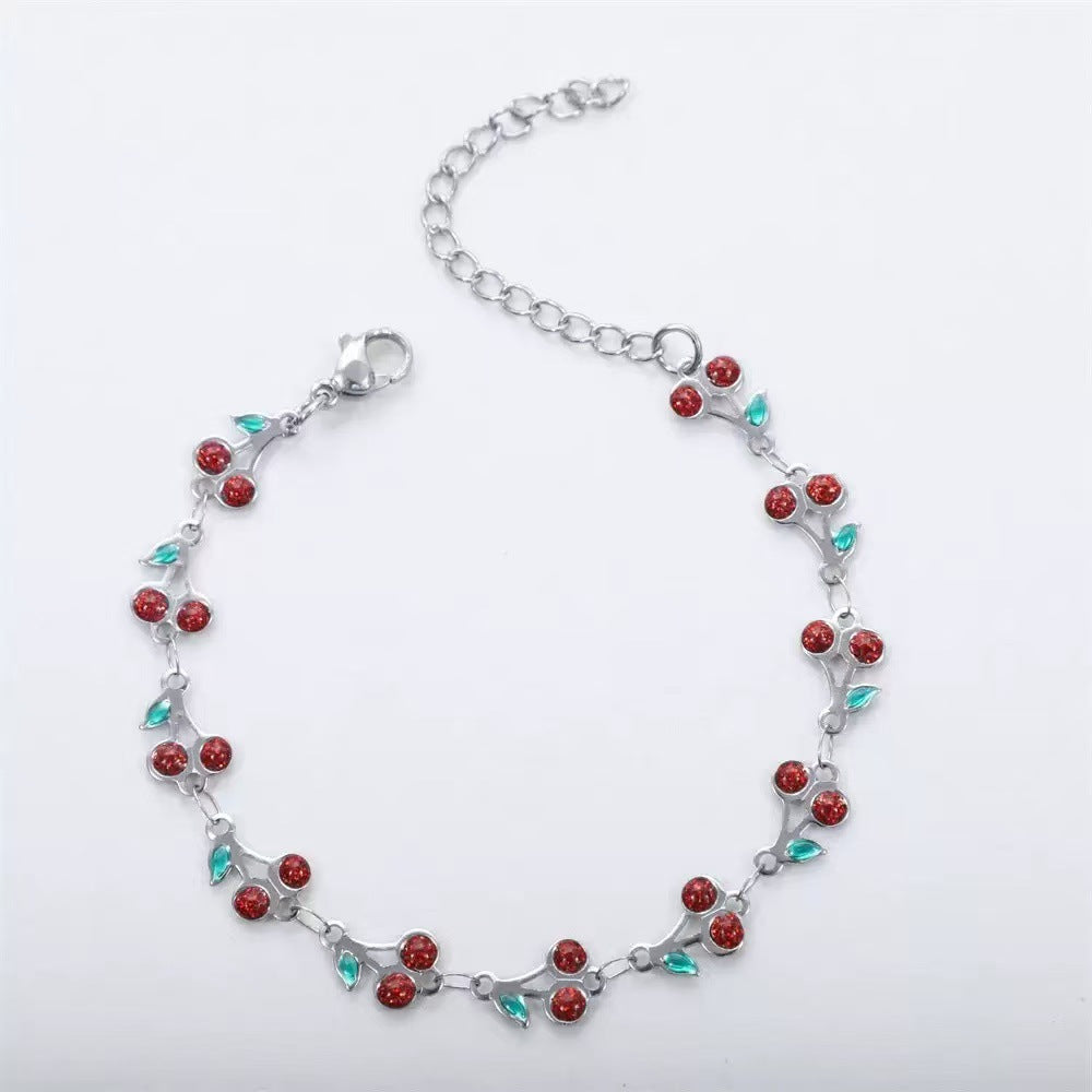 dainty sweet cherry charm link bracelet with playful shimmering summer wristwear design