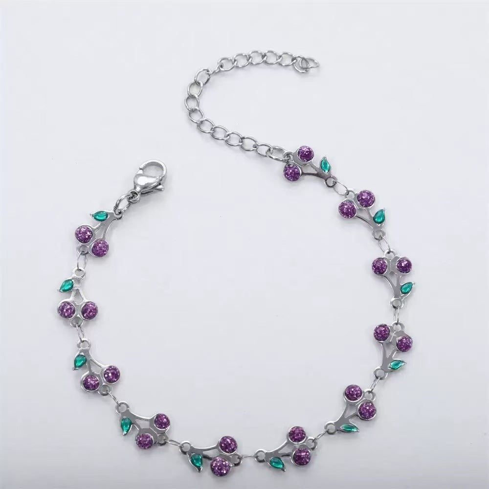 dainty sweet cherry charm link bracelet with playful shimmering summer wristwear design