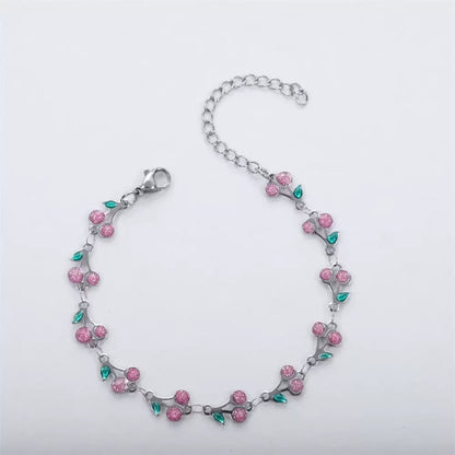 dainty sweet cherry charm link bracelet with playful shimmering summer wristwear design