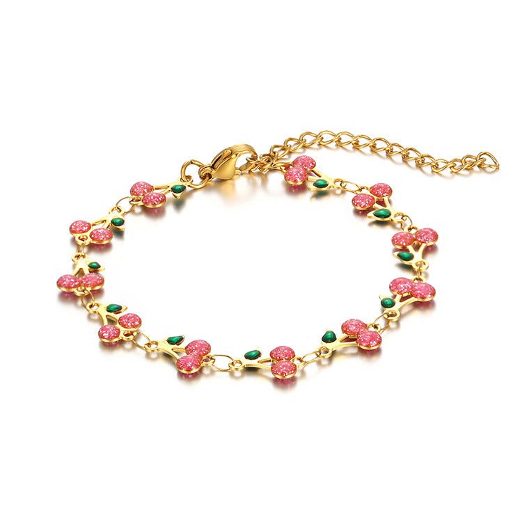 dainty sweet cherry charm link bracelet with playful shimmering summer wristwear design