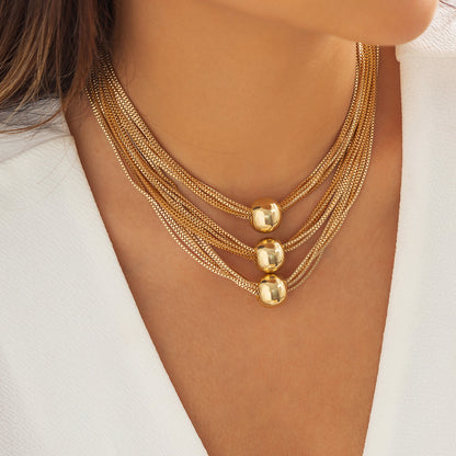 gorgeous model wearing the luxury bohemian multi row metallic chain choker necklace with beads