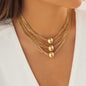 gorgeous model wearing the luxury bohemian multi row metallic chain choker necklace with beads