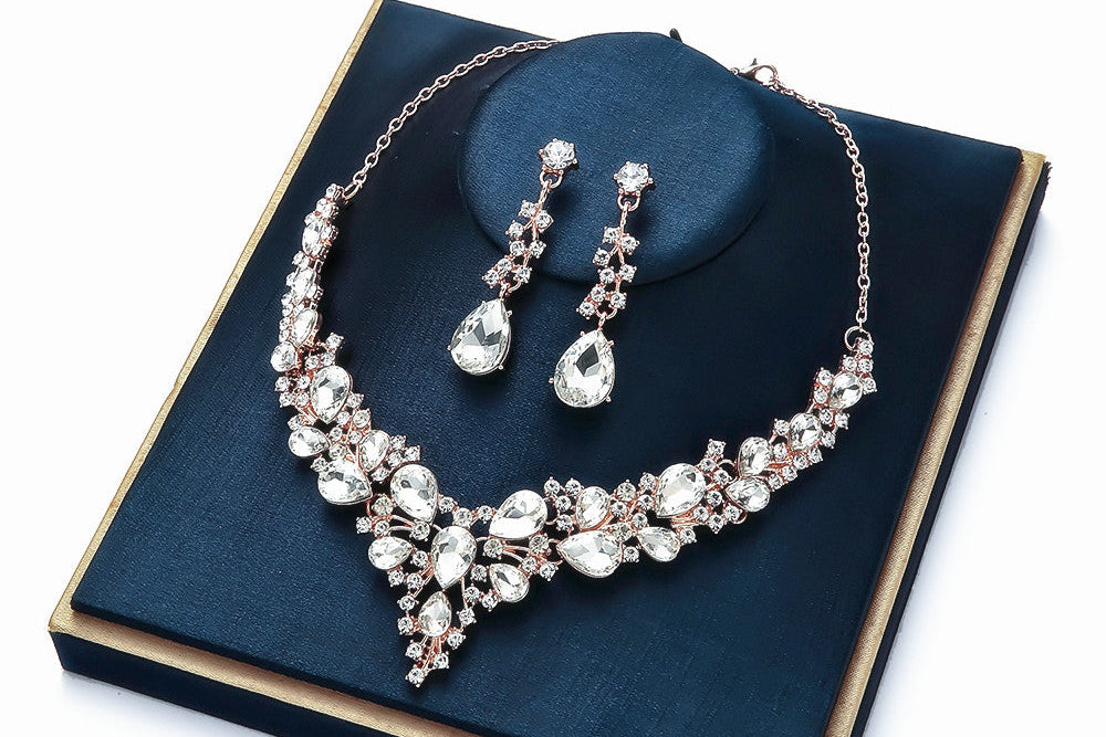 elegant waterdrop crystal bridal jewelry set in classic silver color displayed on a premium dark blue velvet gift box
