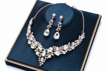 elegant waterdrop crystal bridal jewelry set in classic silver color displayed on a premium dark blue velvet gift box