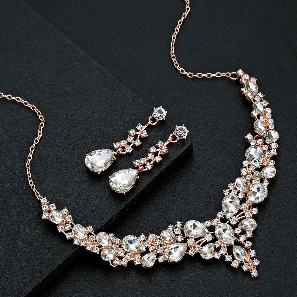 elegant waterdrop crystal bridal jewelry set in rose gold color featuring the full rhinestone necklace and fluid drop earrings