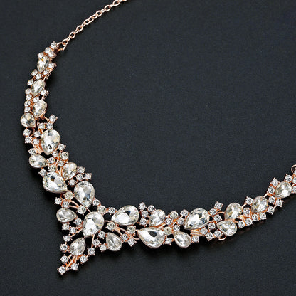 elegant waterdrop crystal bridal jewelry set in rose gold color showcasing a close up view of the rhinestone necklace