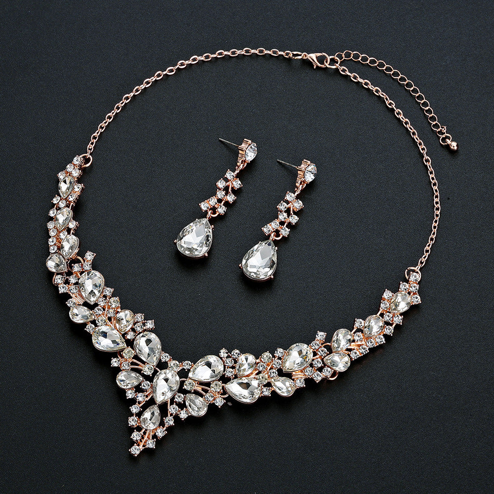 elegant waterdrop crystal bridal jewelry set in rose gold color with rhinestone wedding necklace and matching fluid earrings
