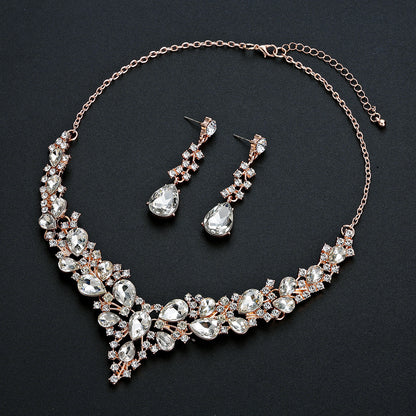 elegant waterdrop crystal bridal jewelry set in rose gold color with rhinestone wedding necklace and matching fluid earrings