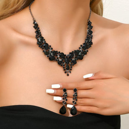 elegant waterdrop crystal bridal jewelry set in sleek black color showcasing the statement statement necklace and matching earrings on a model