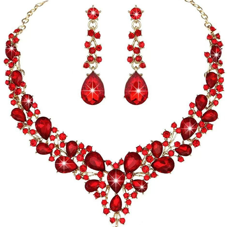 elegant waterdrop crystal bridal jewelry set in vibrant red color with luxury gold statement necklace and matching teardrop earrings