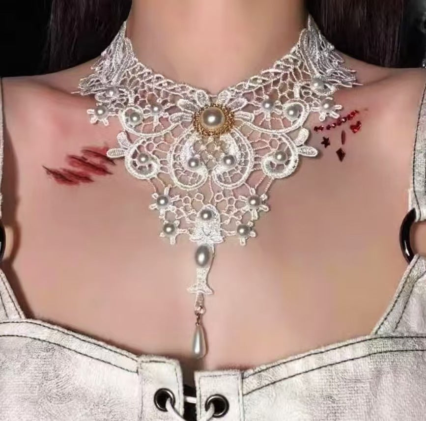 elegant white lace choker necklace with vintage pearl elements and long drop pendant worn by a model