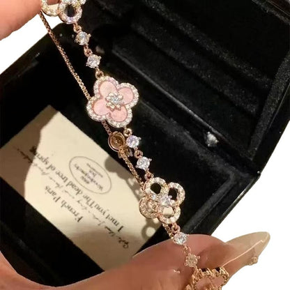 four leaf clover mother of pearl bracelet in gentle pink color with rose gold chain and jewelry box details