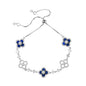 four leaf clover mother of pearl bracelet in royal blue color with silver adjustable chain on a clean white background