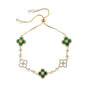 four leaf clover mother of pearl bracelet in vibrant emerald green color with gold adjustable chain on a clean white background