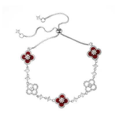 four leaf clover mother of pearl bracelet in vibrant red color with silver adjustable chain on a clean white background