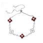 four leaf clover mother of pearl bracelet in vibrant red color with silver adjustable chain on a clean white background