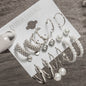 gold chunk hoop pearl earrings set variant arranged on a textured display card showcasing vintage golden elements