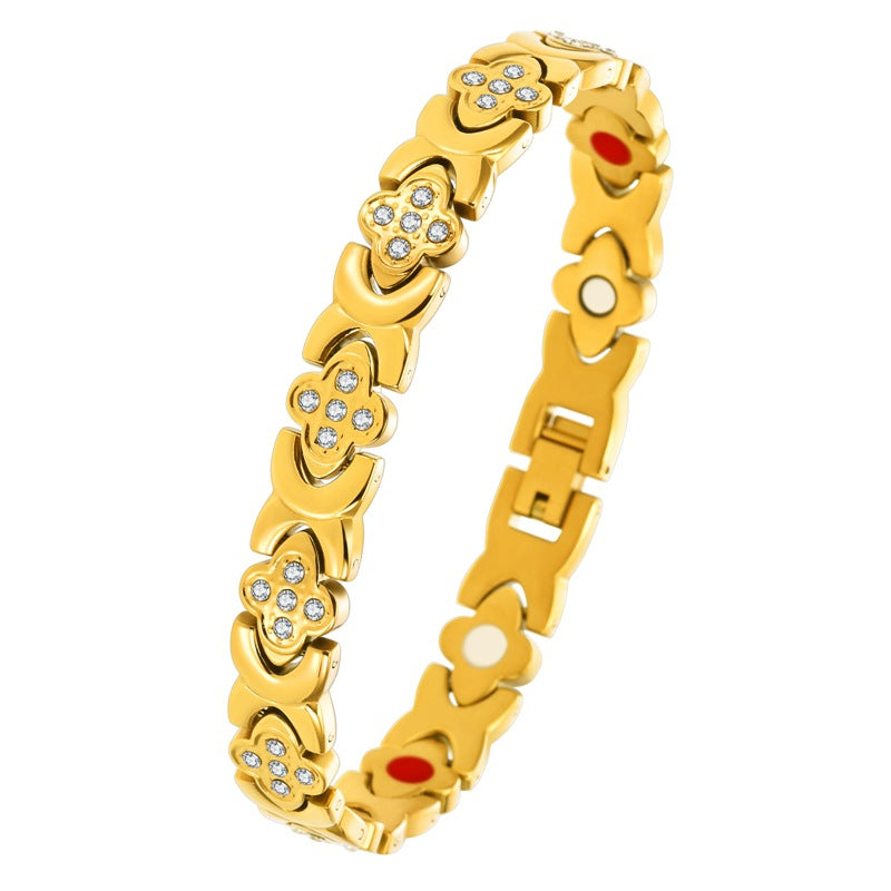premium titanium steel magnetic therapy bracelet in luxury gold color showcasing bright faceted crystal charms and colorful internal wellness magnets