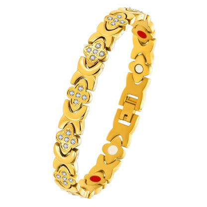 premium titanium steel magnetic therapy bracelet in luxury gold color showcasing bright faceted crystal charms and colorful internal wellness magnets