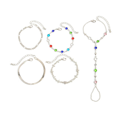 silver finger ring bracelet with bohemian multi layer crystal chains and loose bracelet pieces on a white background