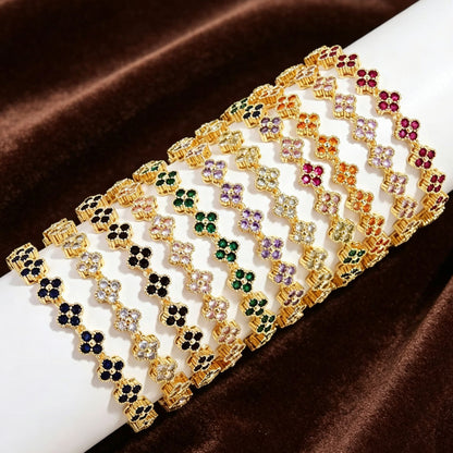 various color options and designs of luxury four leaf clover rhinestone charm bracelets displayed together