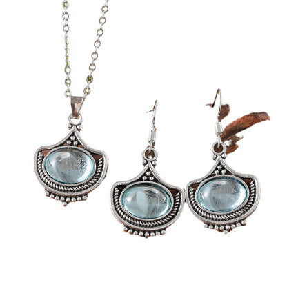 vintage palace style blue gemstone jewelry set with antique silver necklace and earrings